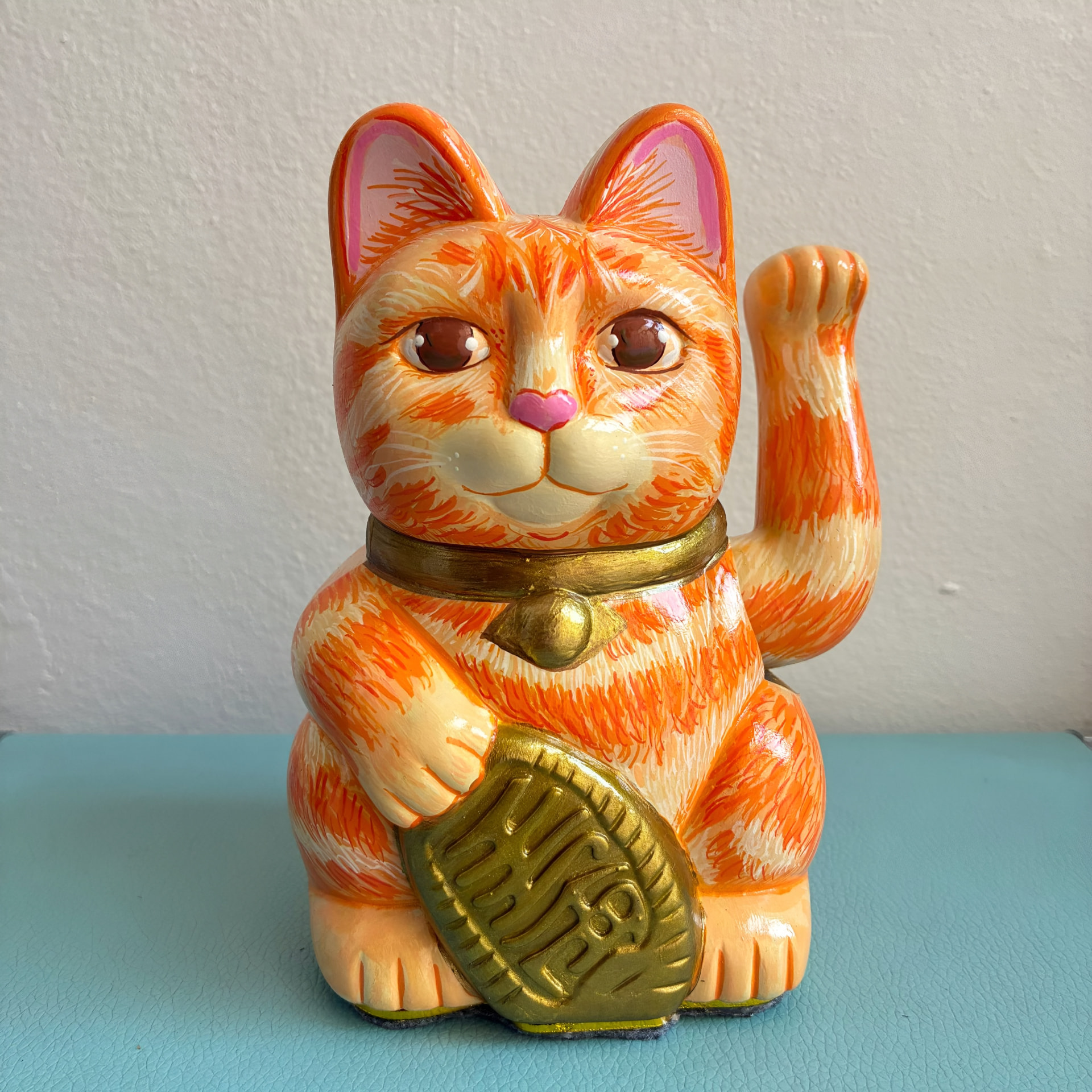 Hand-painted orange tabby Maneki Neko Lucky Cat figurine with a gold coin