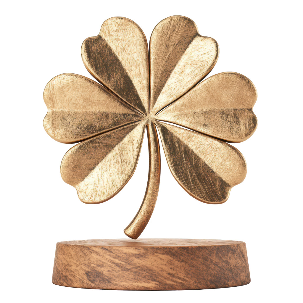 Golden four-leaf clover figurine on a wooden base — Irish luck symbol